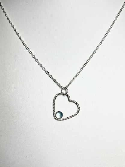 Blue topaz and sterling silver open heart necklace