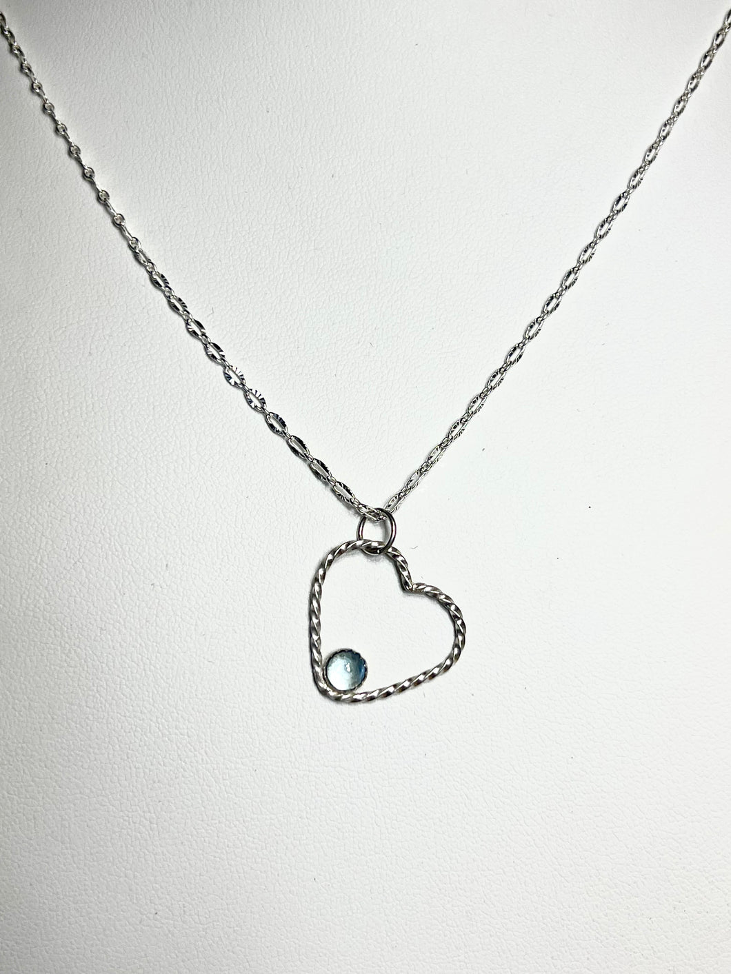 Blue topaz and sterling silver open heart necklace