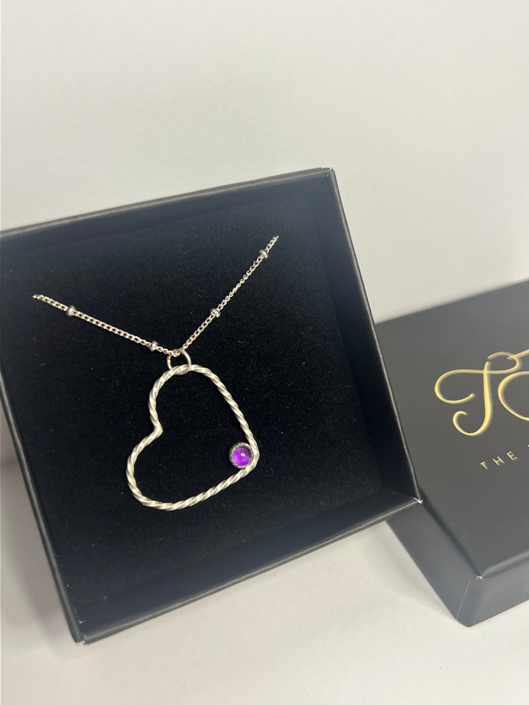 Amethyst and sterling silver open heart necklace
